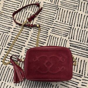 C. Wonder Burgundy Crossbody Bag